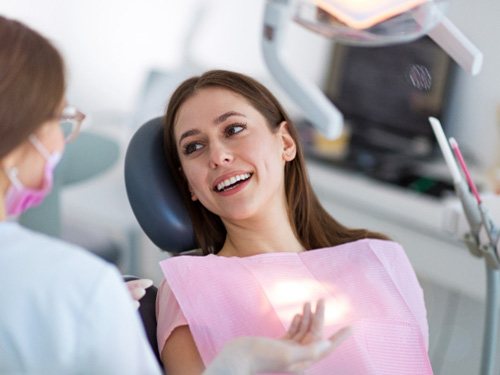Woman talking to her dentist